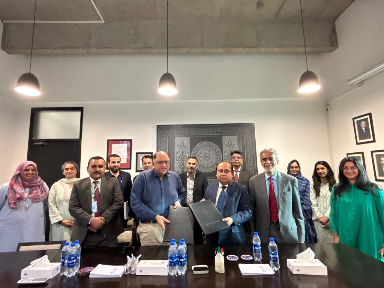 Group photo after signing, Aror University and LUMS officials